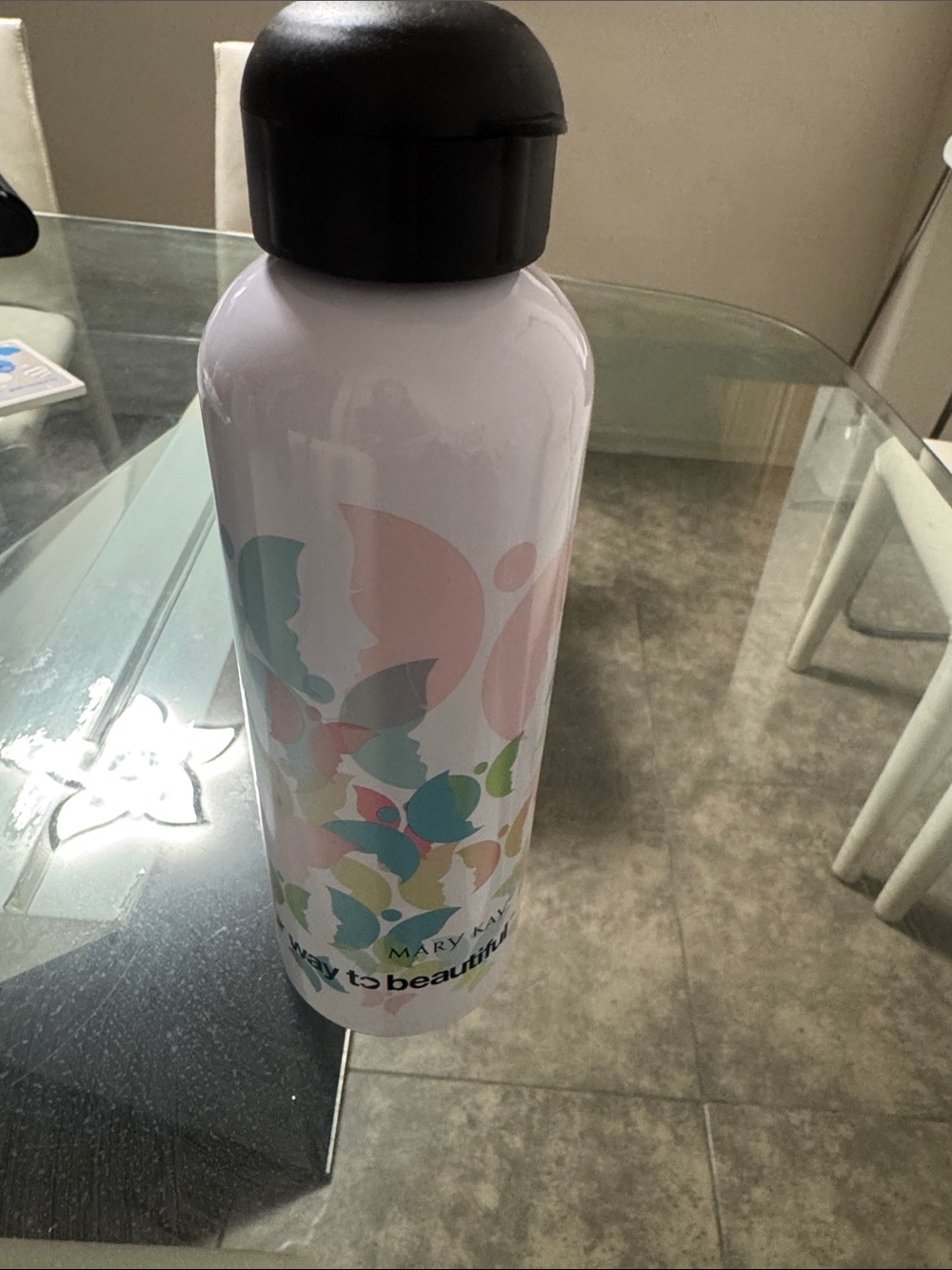 Mary Kay White Bottle with Pastel Floral Design and Black Lid